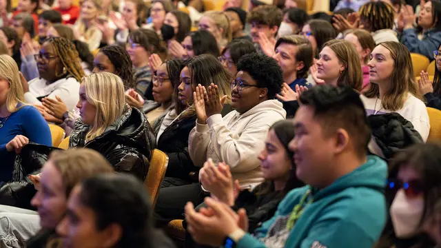 Event photo for UW–Madison’s Black History Month: students applauding in a lecture hall at the keynote.