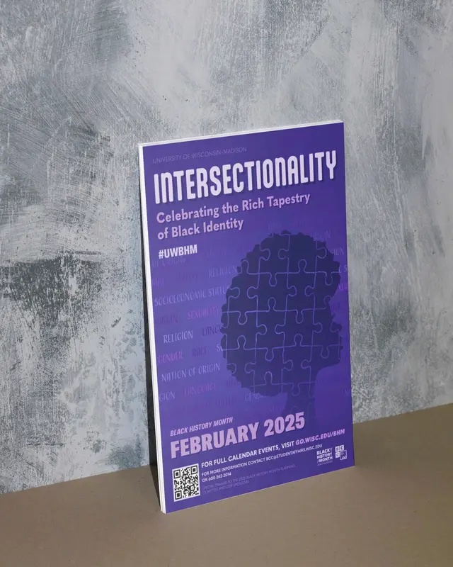 Campaign poster for UW–Madison’s Black History Month: the purple “Intersectionality” poster leaning on a grey wall.