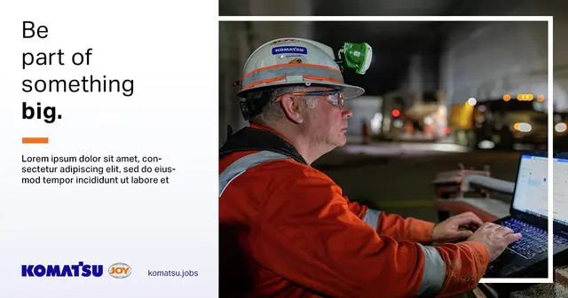 Recruitment graphic for Komatsu: “Be part of something big.” beside a worker in a hard hat at a laptop.
