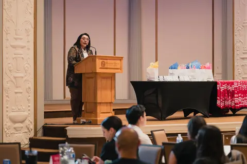 Event photo for the Multicultural Student Center: a speaker at the podium on stage at the Student Achievement Gala.