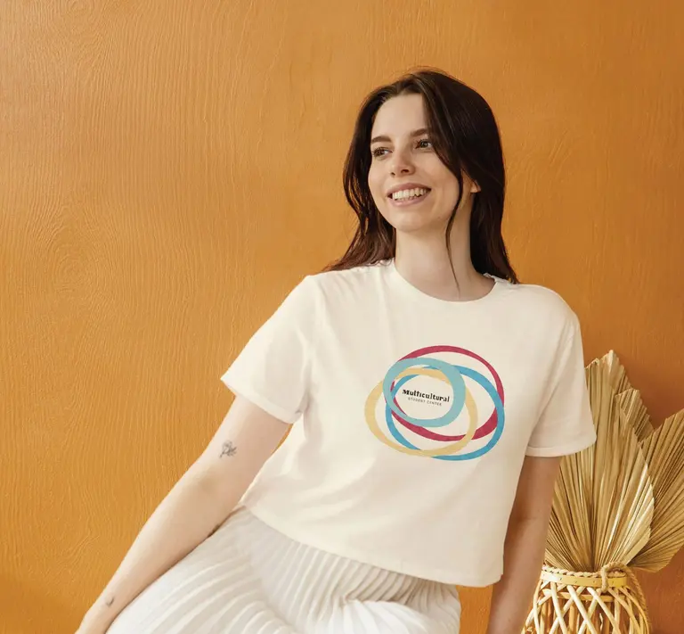 Team apparel for the Multicultural Student Center: a cream shirt with four overlapping circles around the MSC logo.