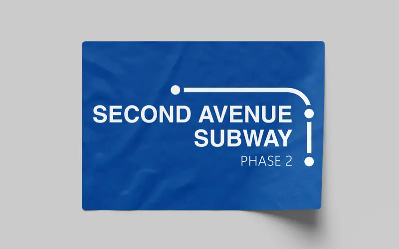 Merchandise for the Second Avenue Subway: a blue sticker with the white Phase 2 lockup.