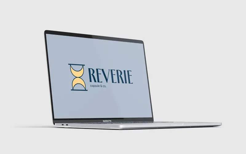 Digital application for Reverie Capsule & Co.: the logo on a laptop screen.