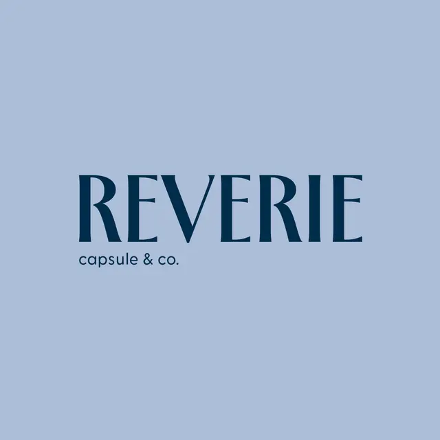 Wordmark for Reverie Capsule & Co.: “Reverie capsule & co.” in midnight on blue gray.