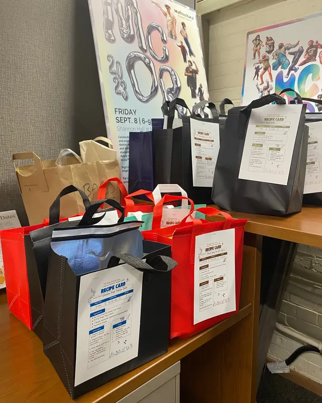 In-space display for Snack n’ Go: donation bags with recipe cards on a table in the MSC.